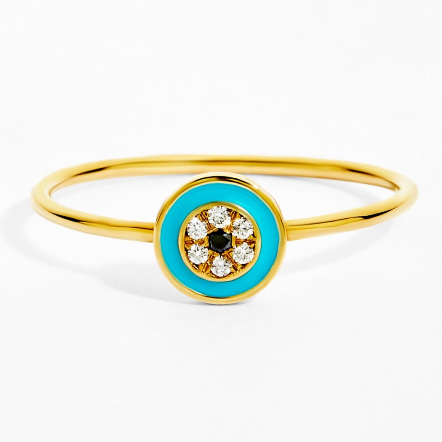 Gold ring with a blue Evil Eye design on a white background