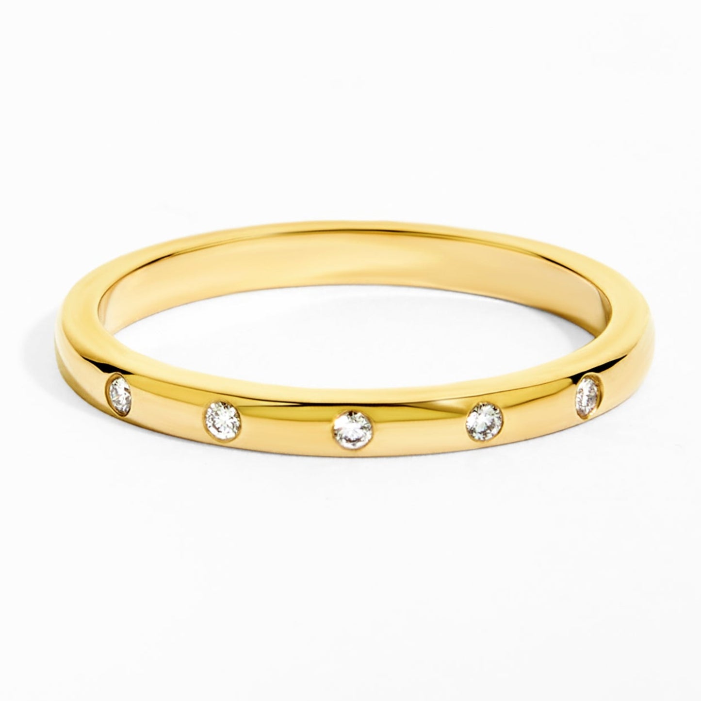 Gold ring with small diamonds on a white background