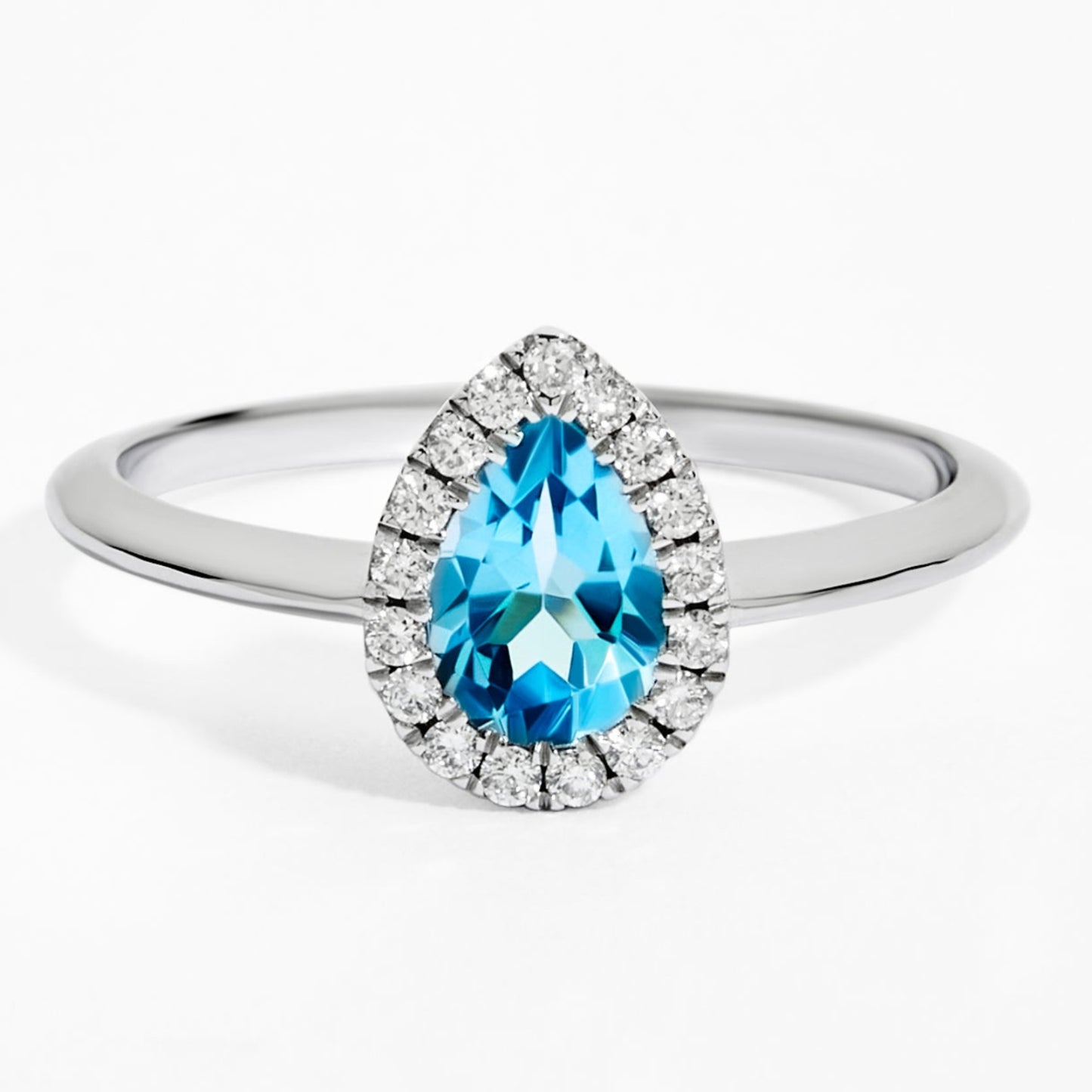 Pear Cut Blue Topaz & Diamond Solitaire Ring in White Gold