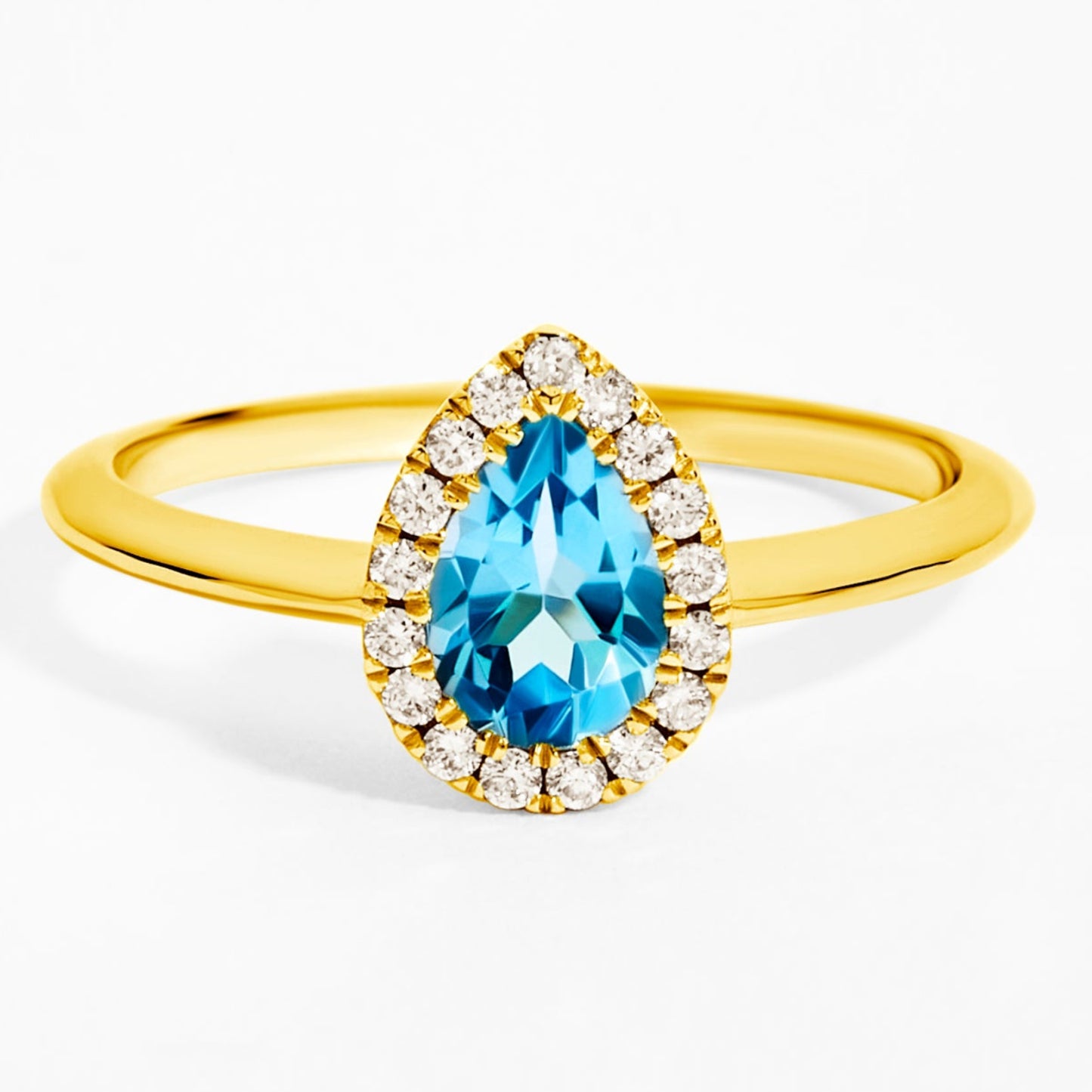 Pear Cut Blue Topaz & Diamond Solitaire Ring in Yellow Gold