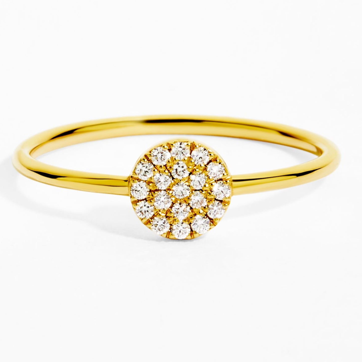 Gold ring with a diamond cluster on a white background
