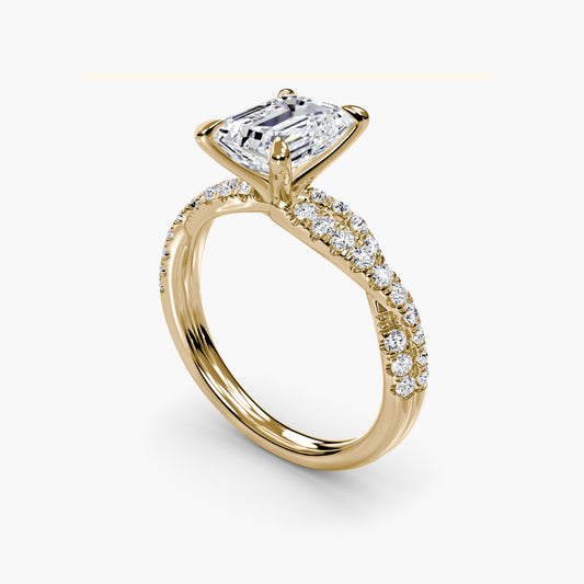 The Twisted Pavé Solitaire Emerald cut in Yellow Gold