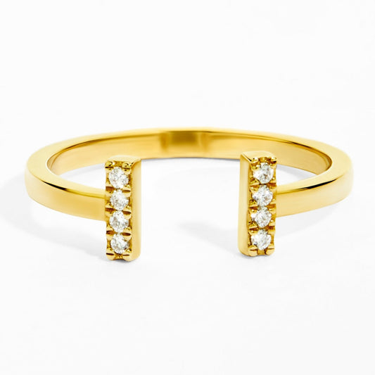 Gold ring with small diamonds on a white background