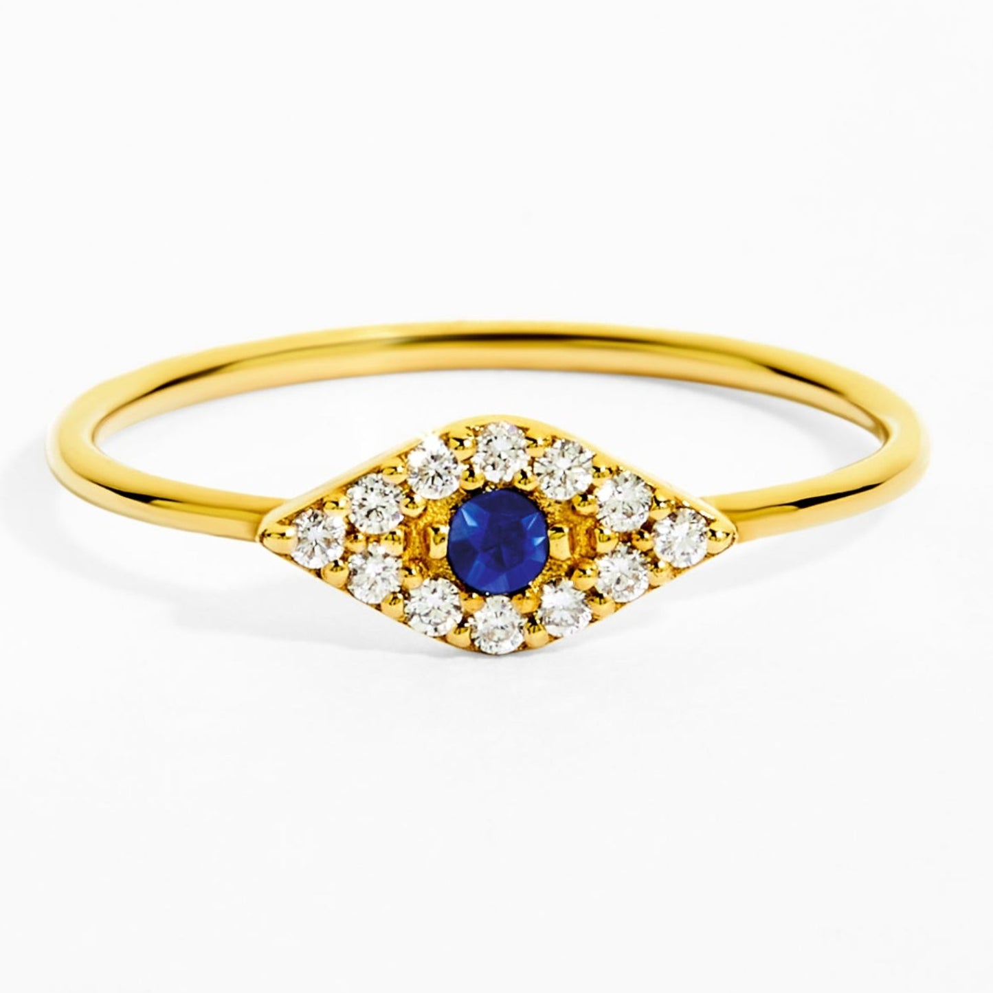 Gold ring with a blue gemstone and diamond accents on a white background