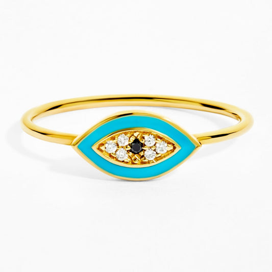 Gold ring with blue enamel and gemstones on a white background