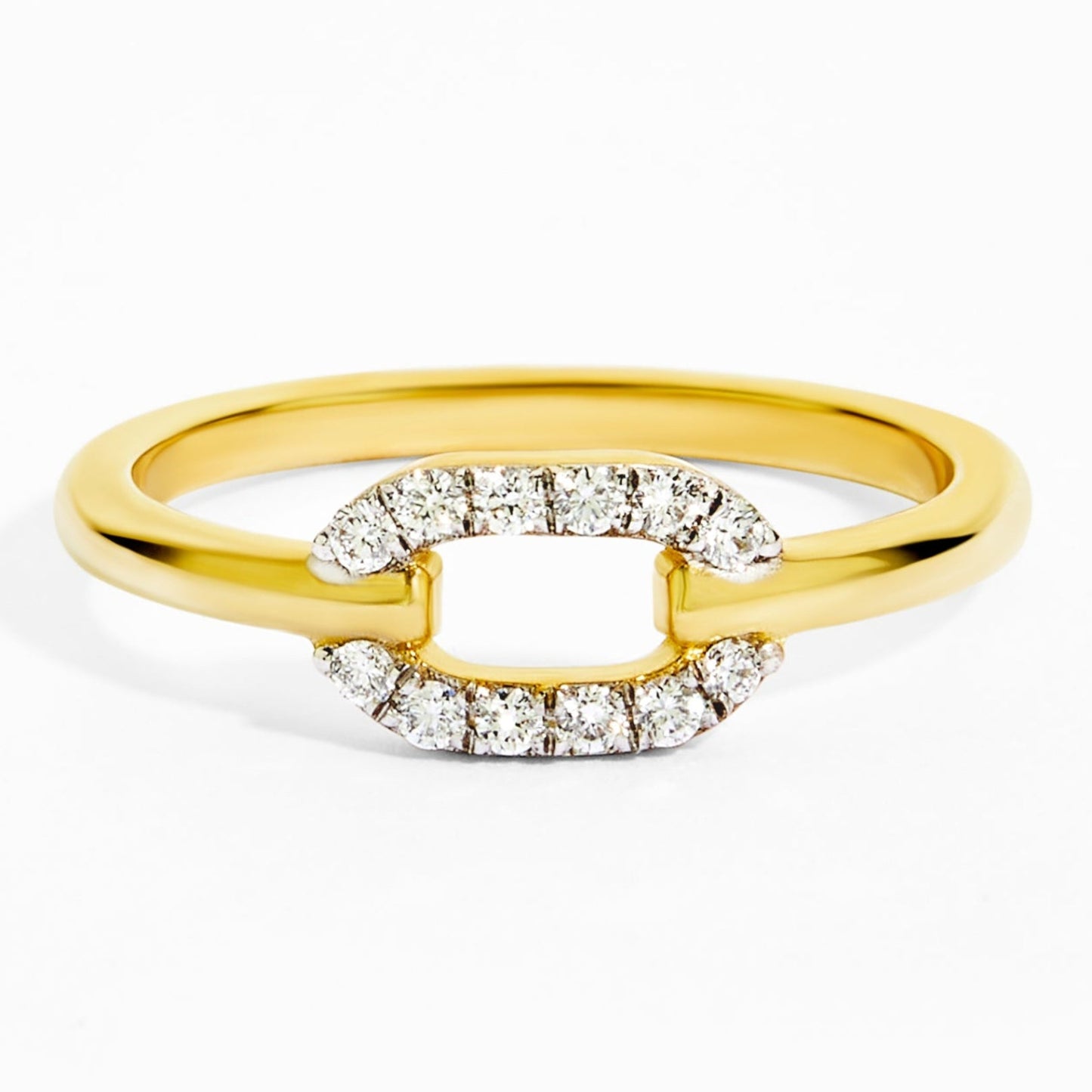 Gold ring with diamond accents on a white background