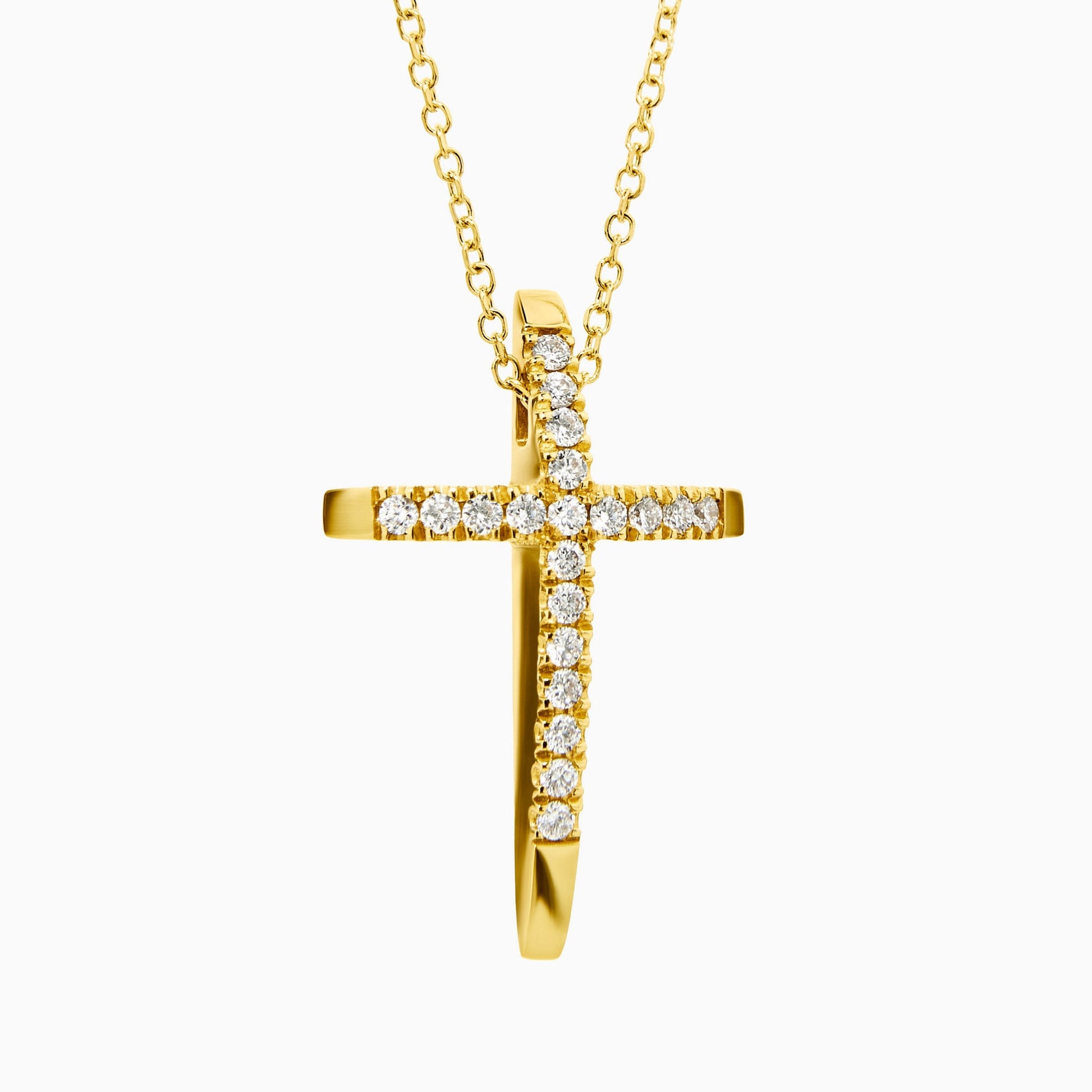 Gold cross necklace with diamonds on a white background