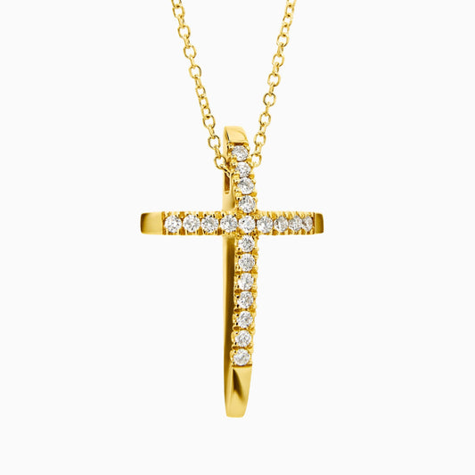 Gold cross necklace with diamonds on a white background