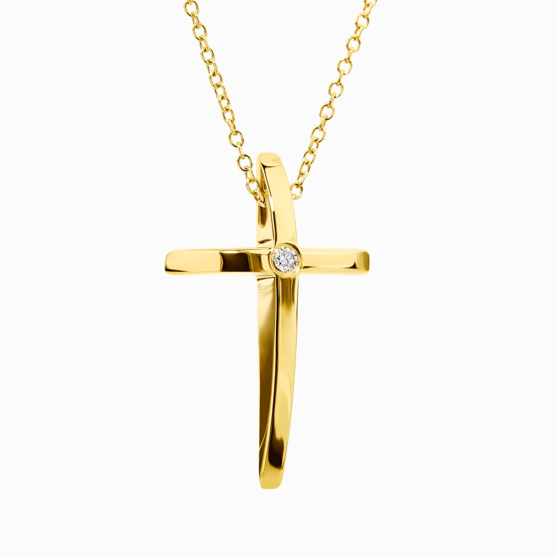 Gold cross pendant necklace on a white background