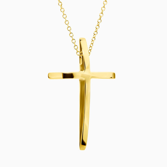 Gold cross pendant on a chain against a white background