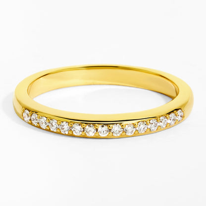 Gold ring with small diamonds on a white background
