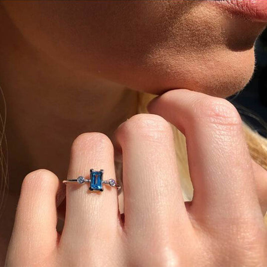 Diamond & Baguette Swiss Blue Topaz Solitaire Ring in 18K White Gold