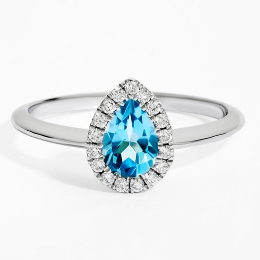 Pear Cut Blue Topaz & Diamond Solitaire Ring in White Gold