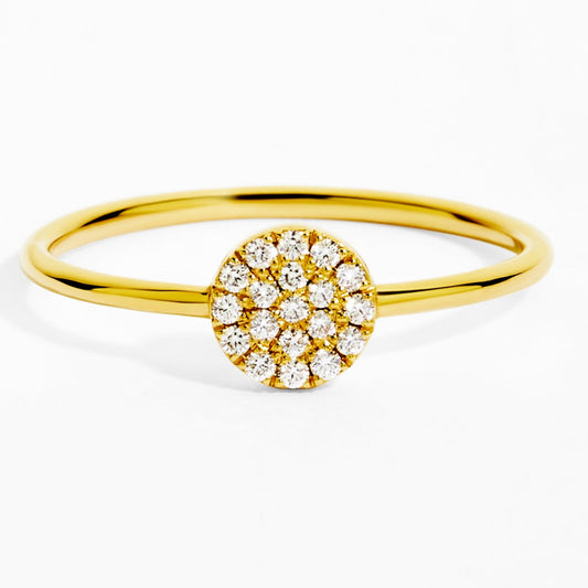 Gold ring with a diamond cluster on a white background