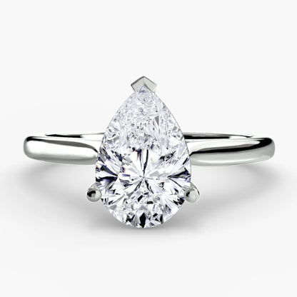 Pear-shaped diamond ring on a white background
