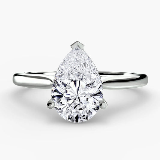 Pear-shaped diamond ring on a white background