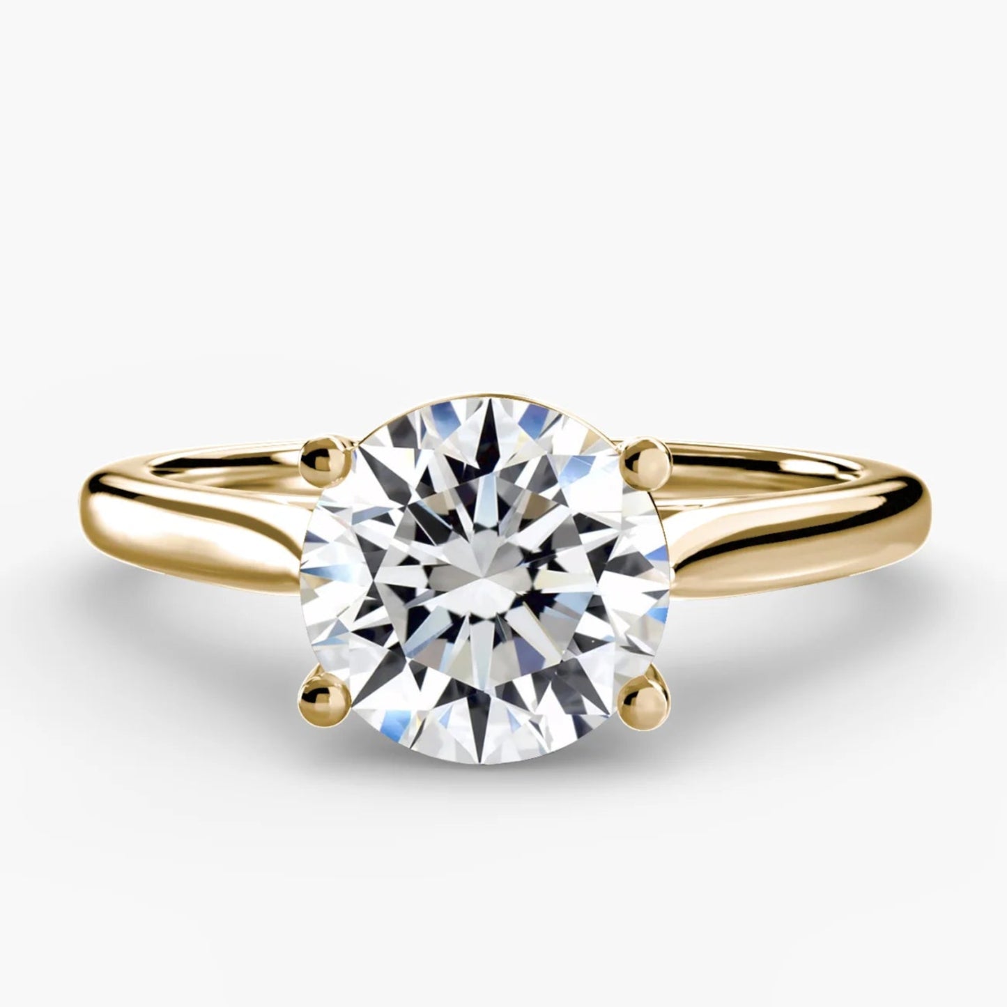 Gold ring with a diamond on a white background