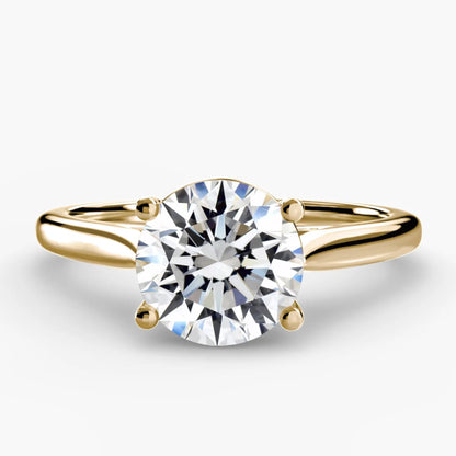 Gold ring with a diamond on a white background