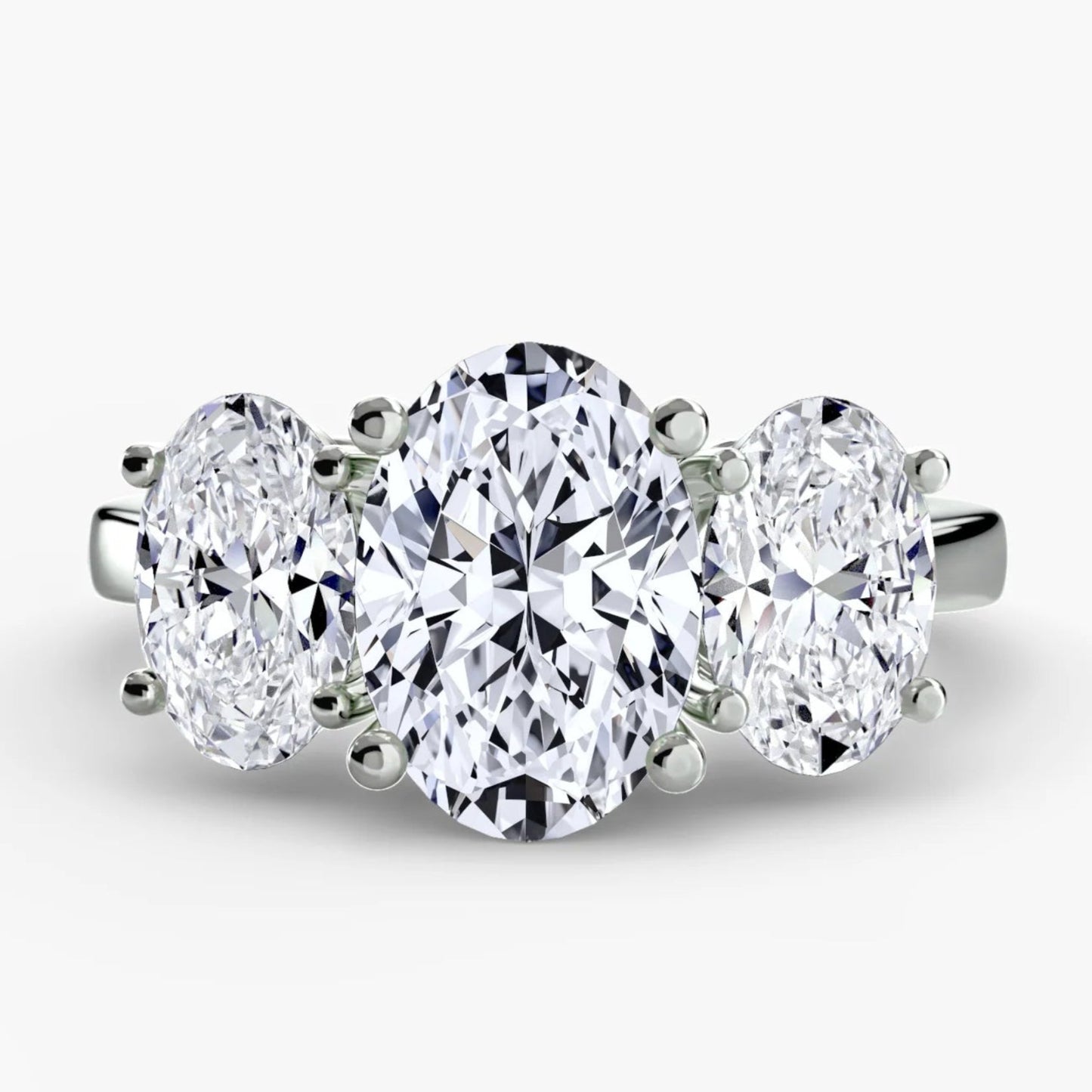Three-stone diamond ring on a white background
