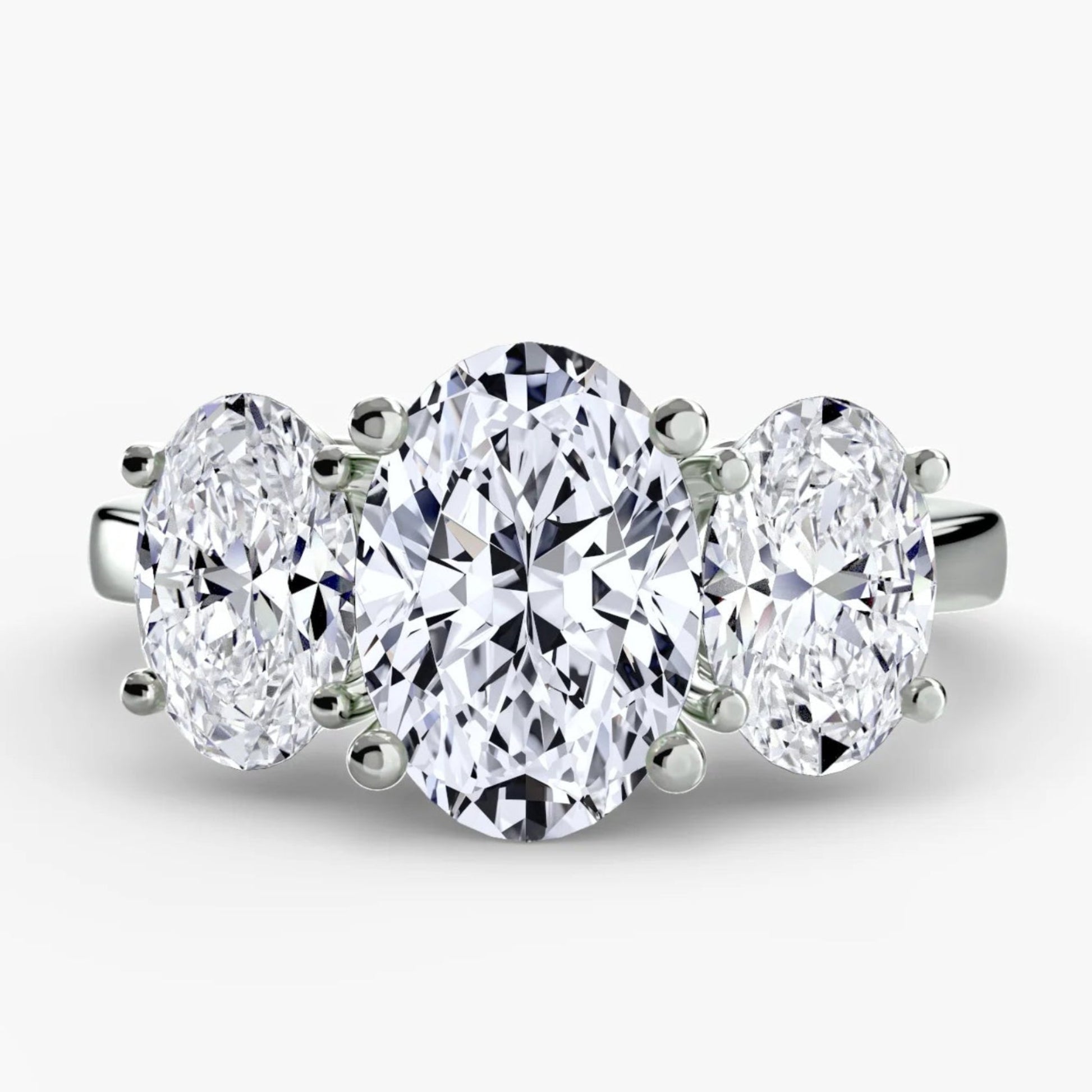 Three-stone diamond ring on a white background