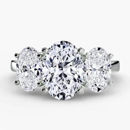 Three-stone diamond ring on a white background