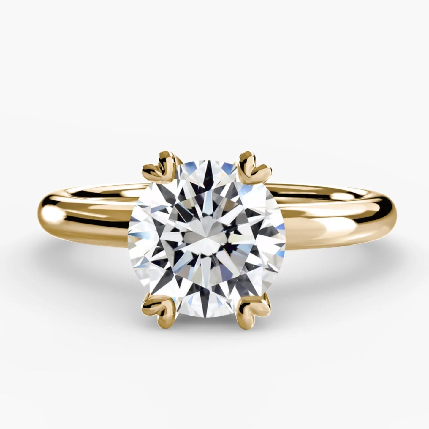Gold ring with a diamond on a white background