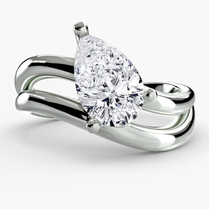 Diamond ring with a pear-shaped gemstone on a white background
