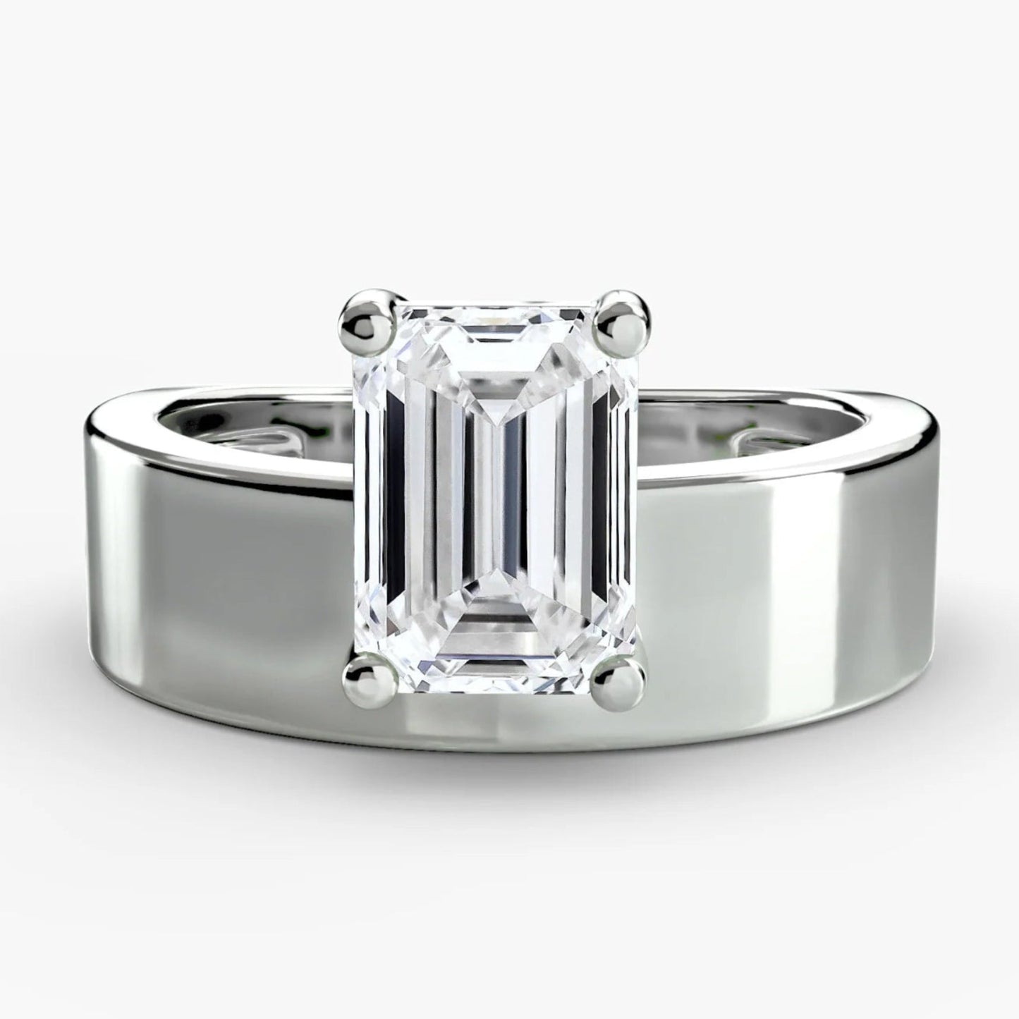 Silver ring with a rectangular diamond on a white background