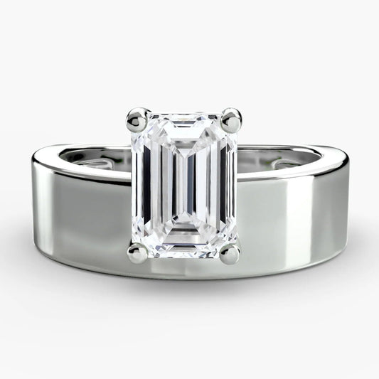 Silver ring with a rectangular diamond on a white background