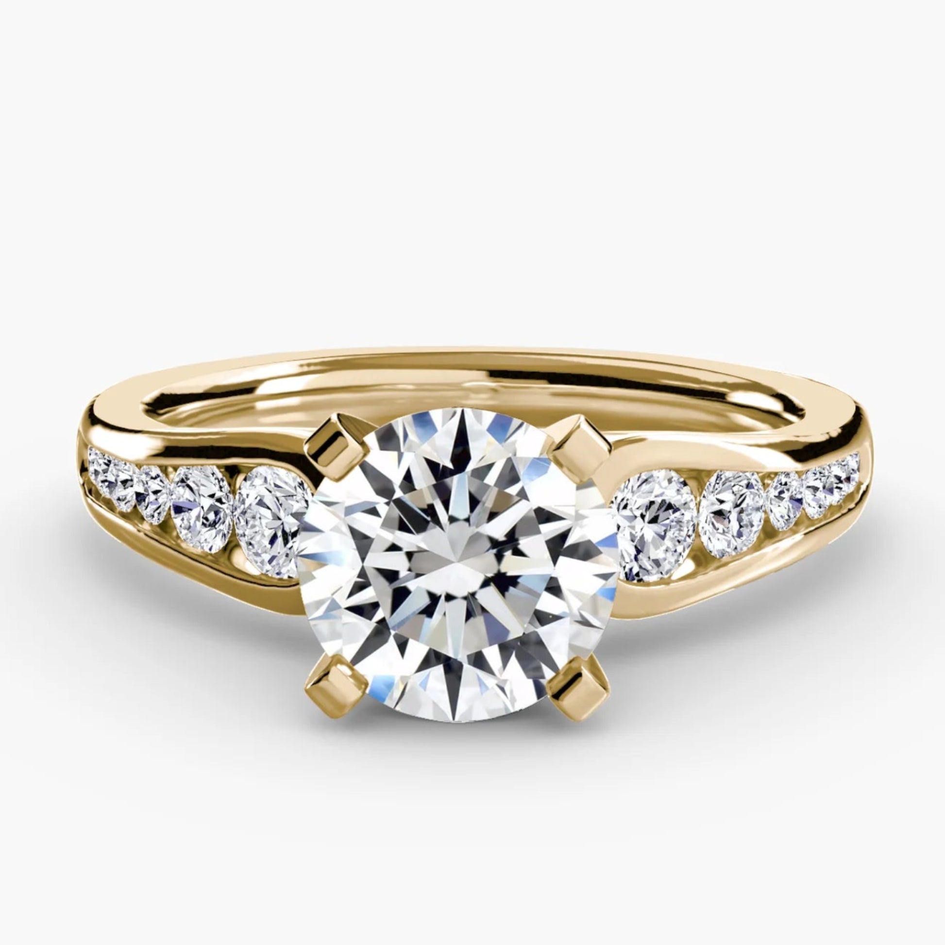 Gold ring with a diamond on a white background
