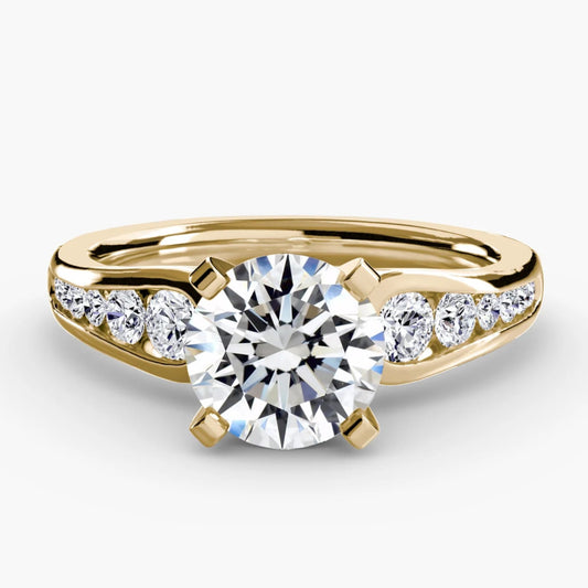 Gold ring with a diamond on a white background
