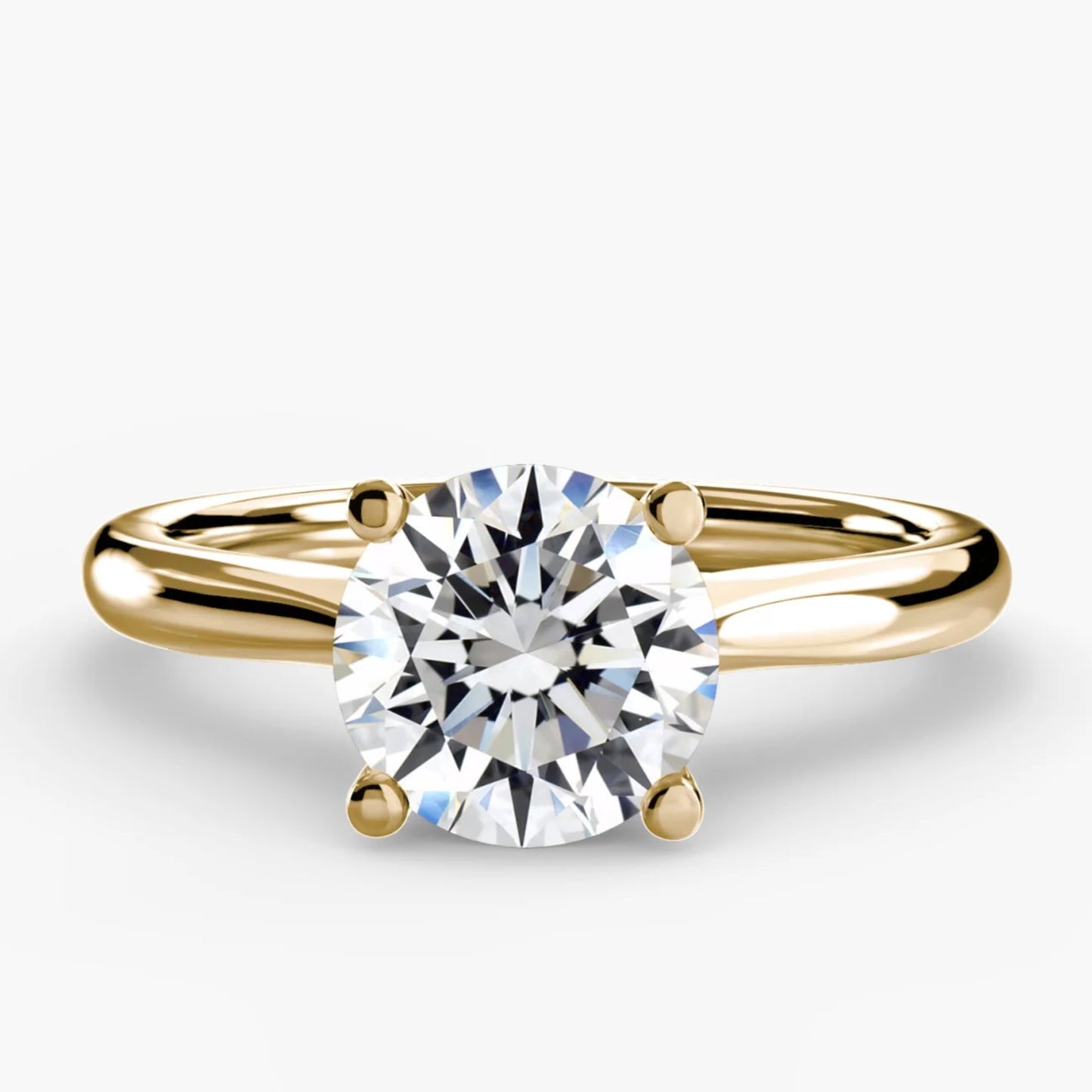 Gold ring with a diamond on a white background