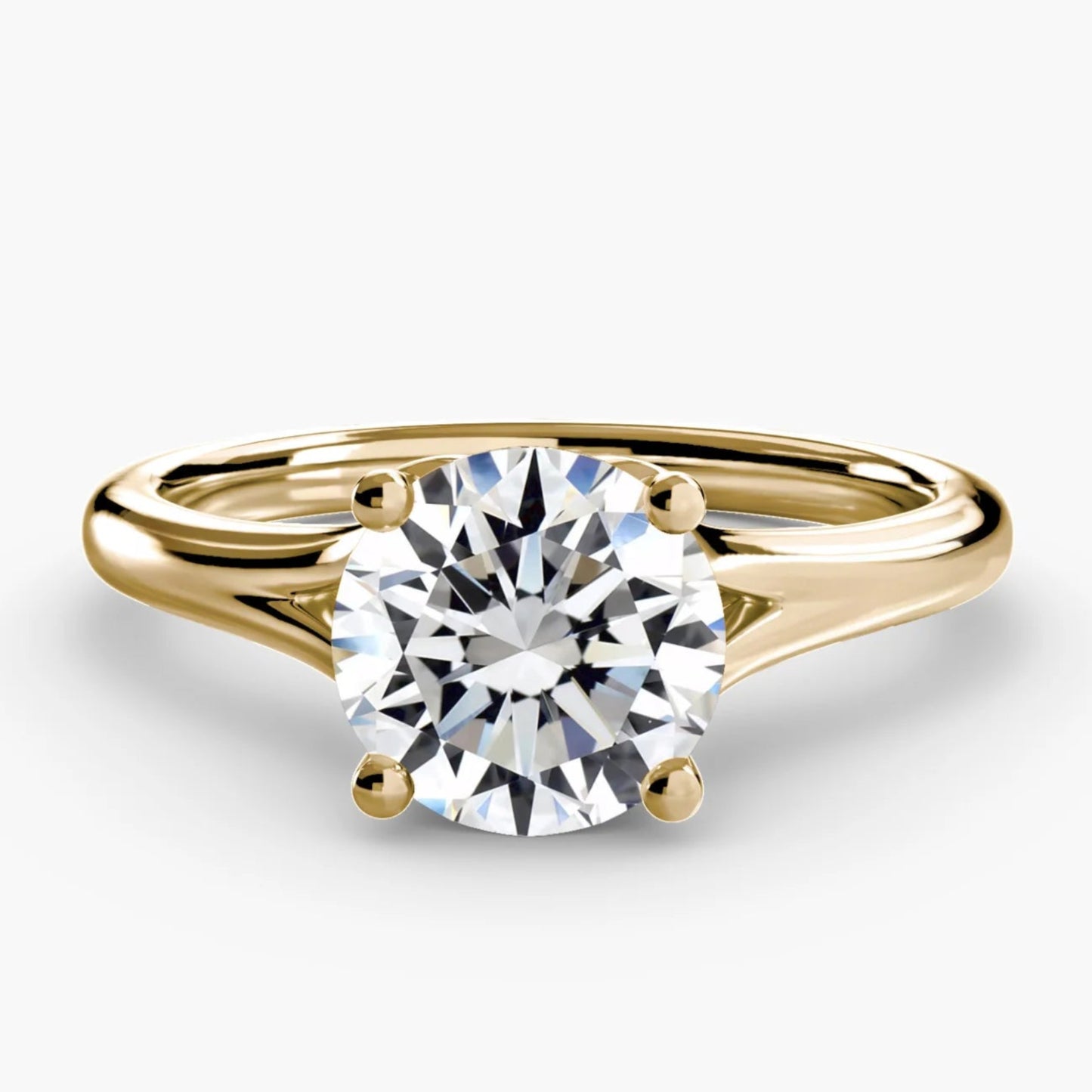 Gold ring with a diamond on a white background