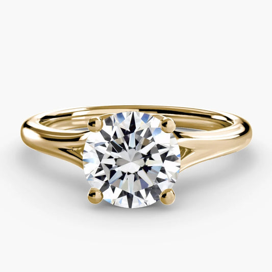 Gold ring with a diamond on a white background