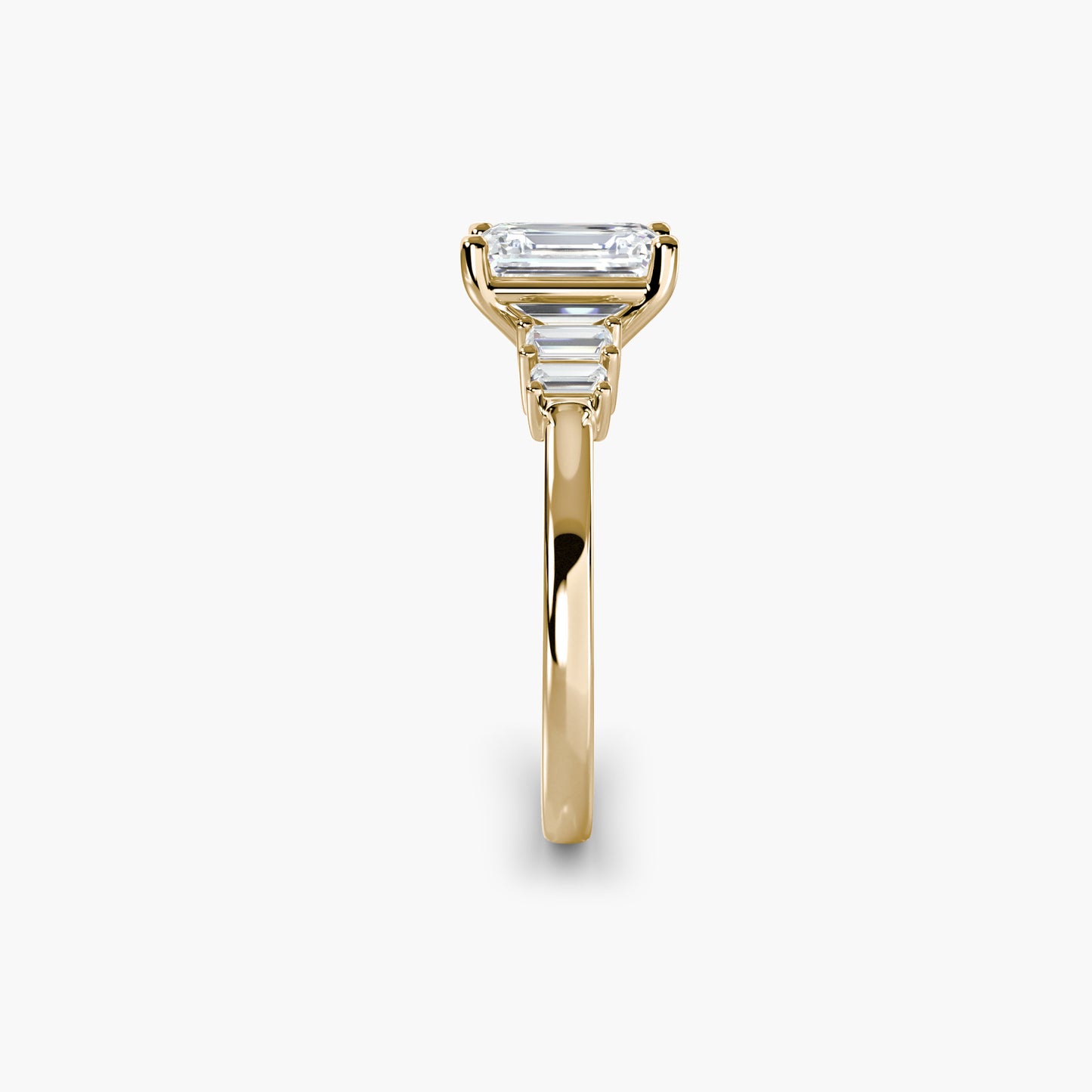 Baguette Accent Solitaire Emerald cut in Yellow Gold