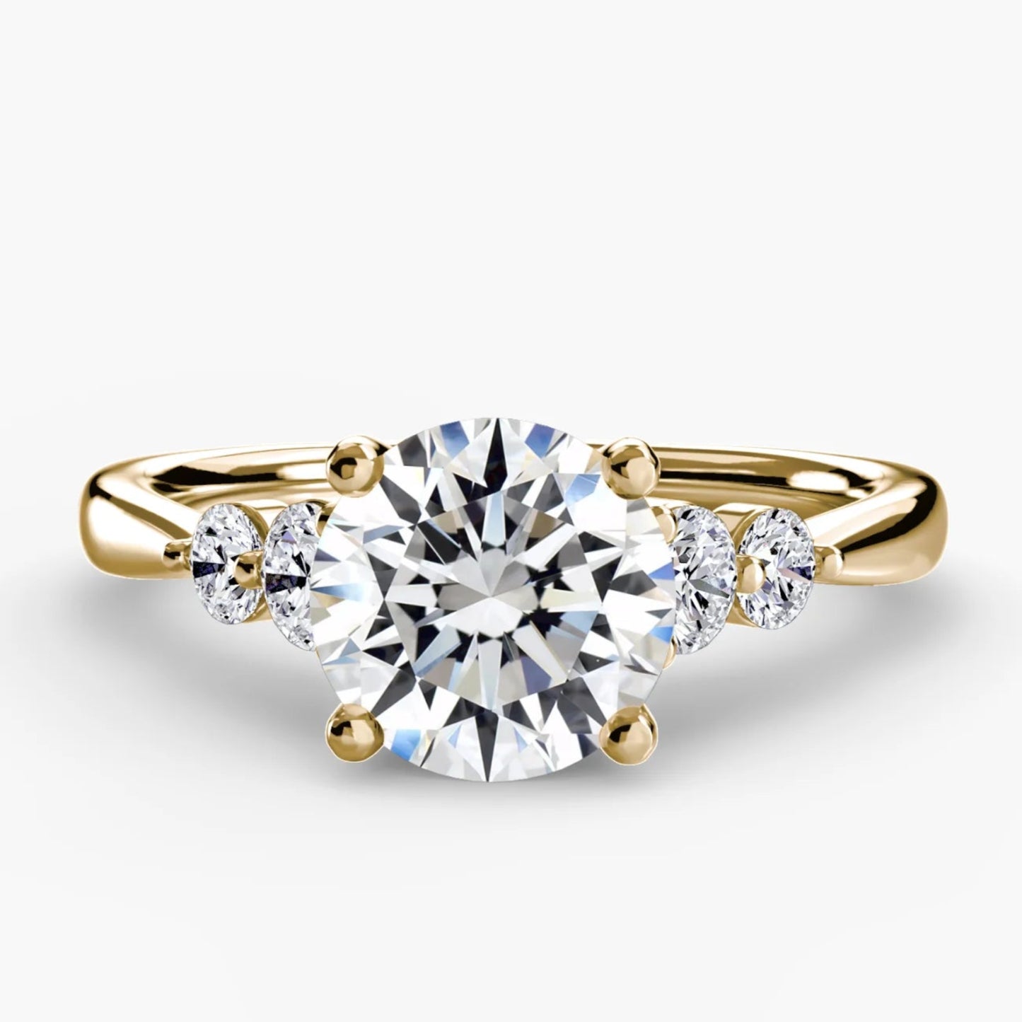 Solitaire with Shoulder Accents 2 Round in Yellow Gold