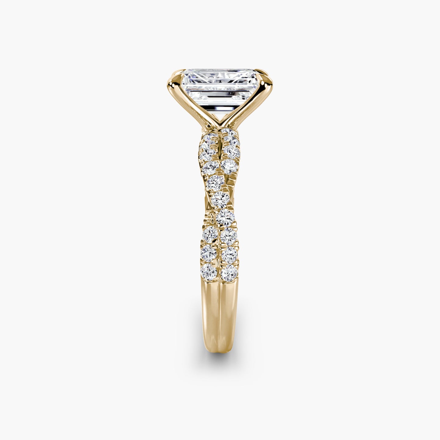The Twisted Pavé Solitaire Emerald cut in Yellow Gold