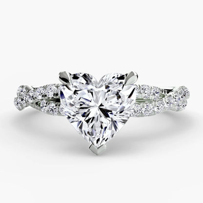 Heart-shaped diamond ring with a white background