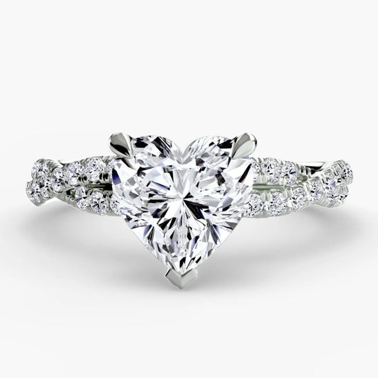 Heart-shaped diamond ring with a white background