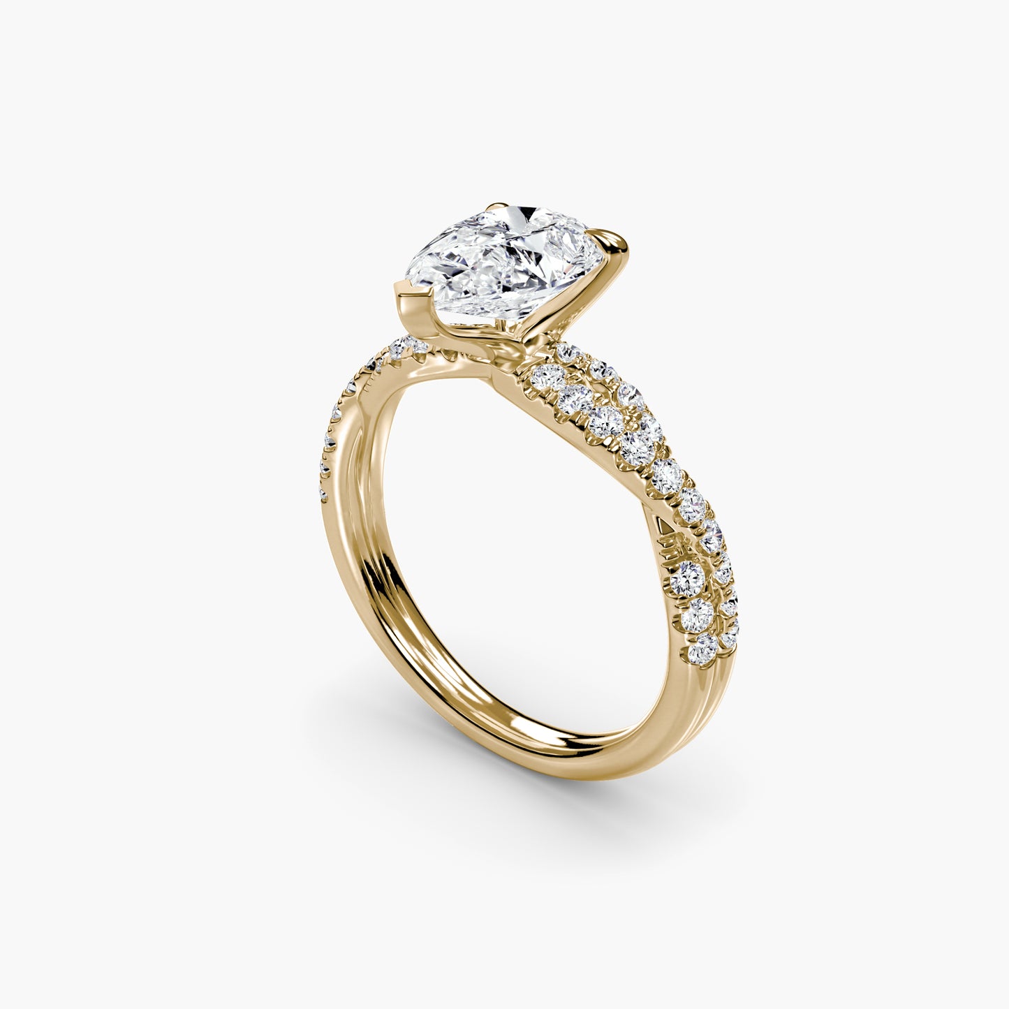 The Twisted Pavé Solitaire Pear shape in Yellow Gold