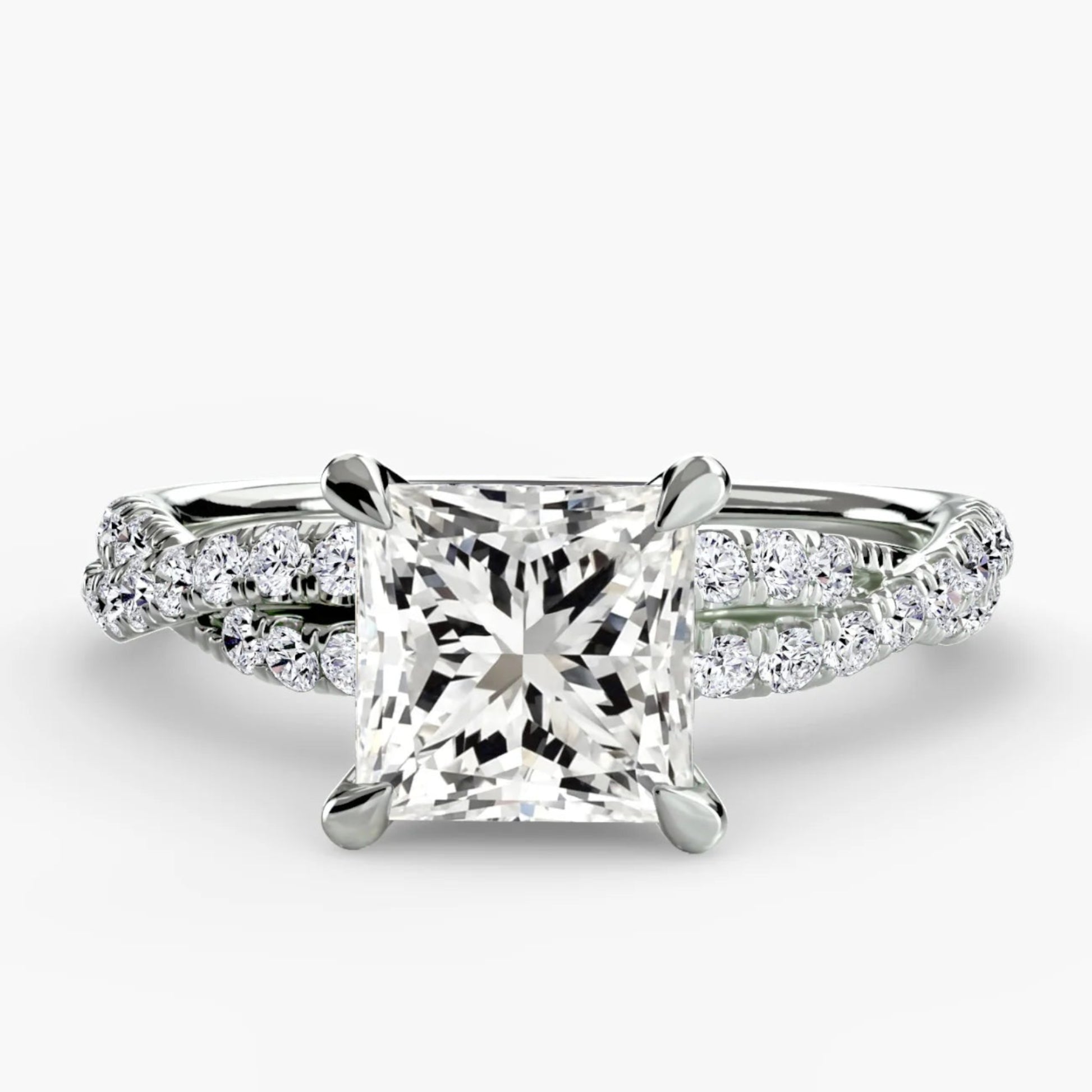 Diamond ring with a central princess-cut diamond on a white background
