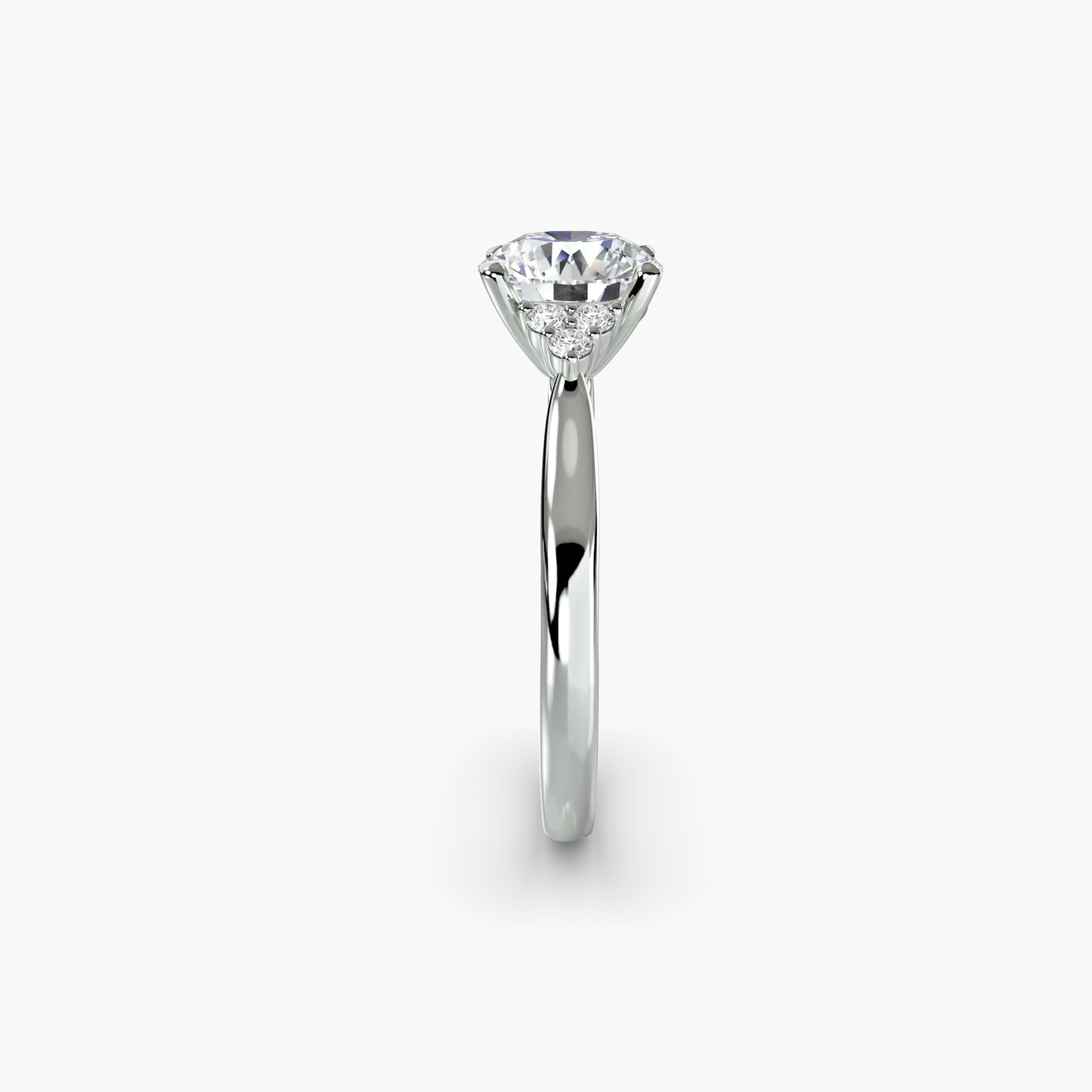 Solitaire with Cluster Shoulders in White Gold