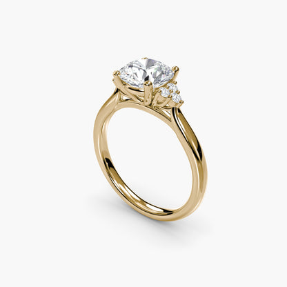 Solitaire with Cluster Shoulders in Yellow Gold