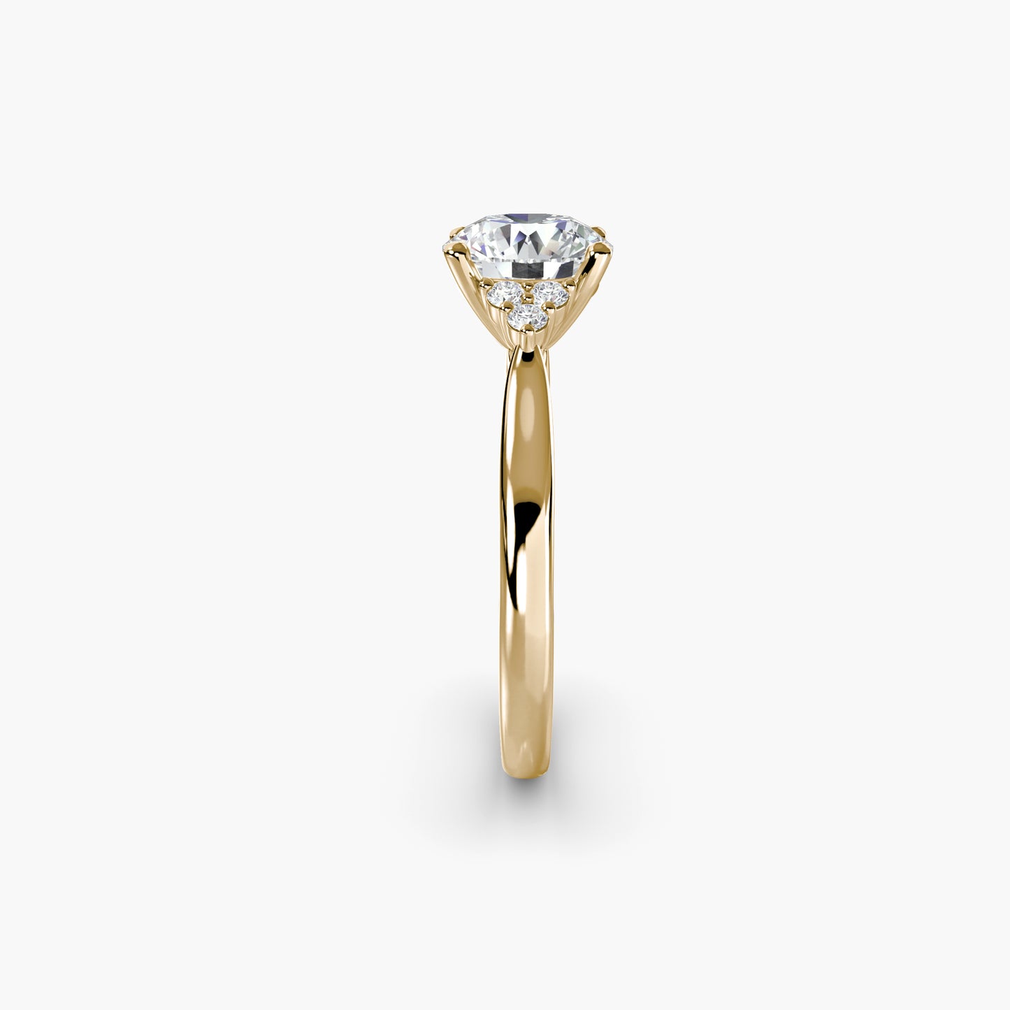 Solitaire with Cluster Shoulders in Yellow Gold