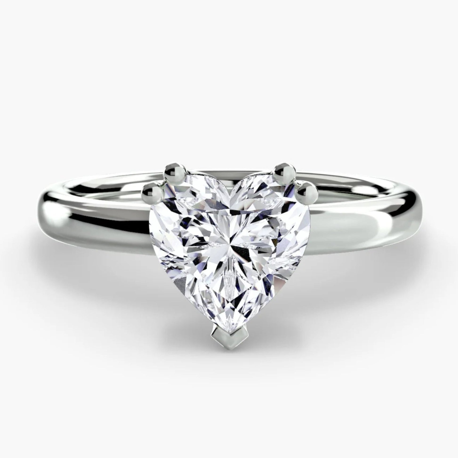 Diamond ring with a heart-shaped gemstone on a white background