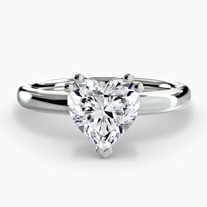 Diamond ring with a heart-shaped gemstone on a white background