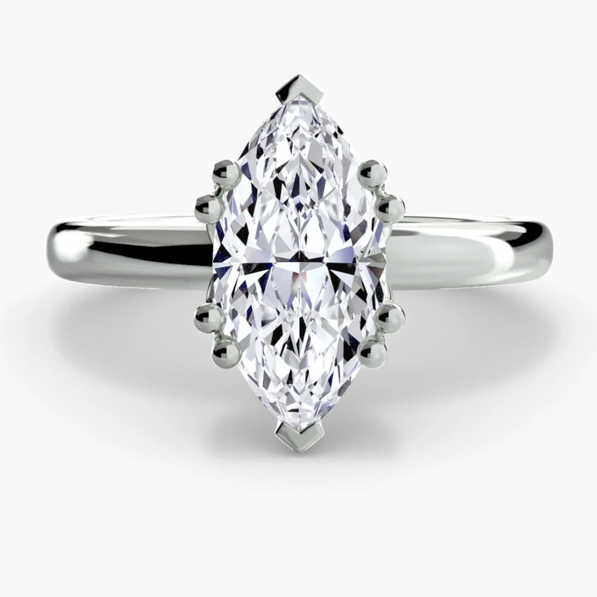 Diamond ring with a marquise-shaped gemstone on a white background