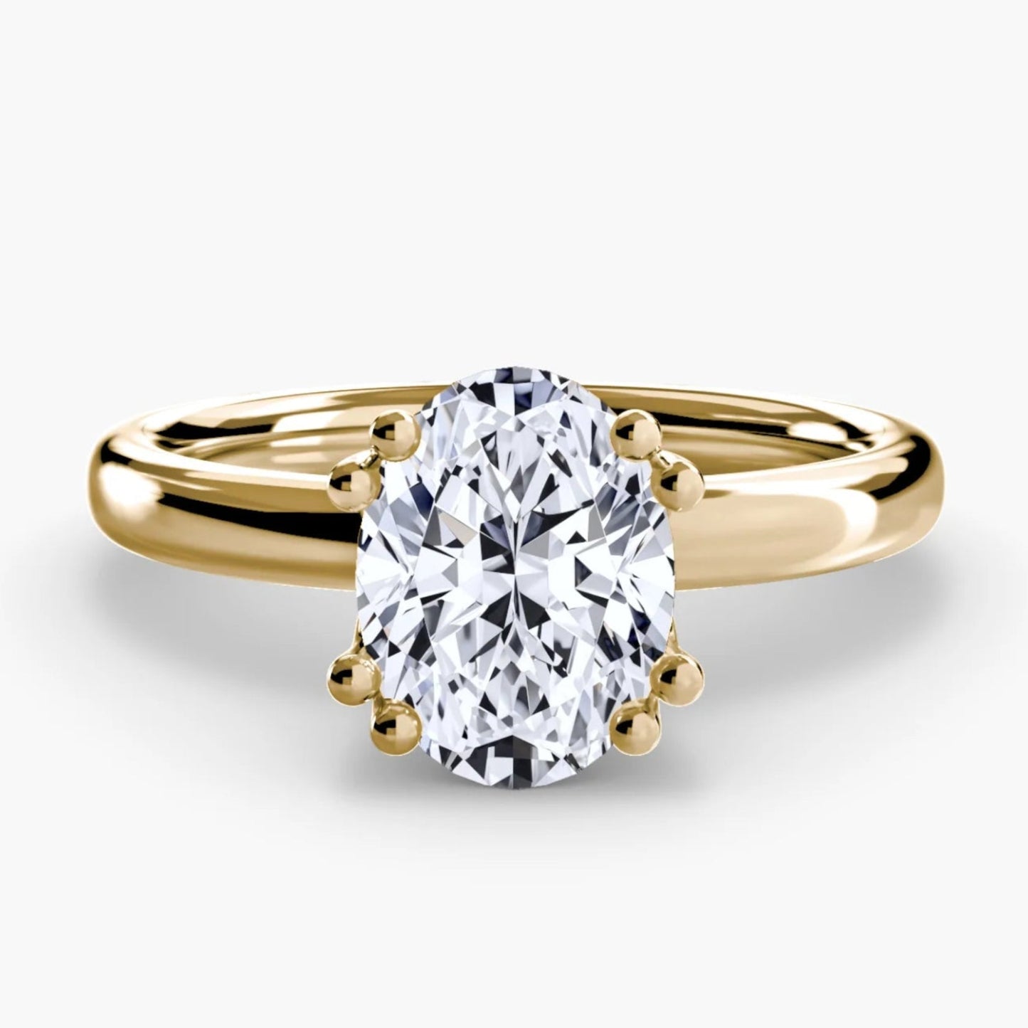 Gold ring with a large diamond on a white background