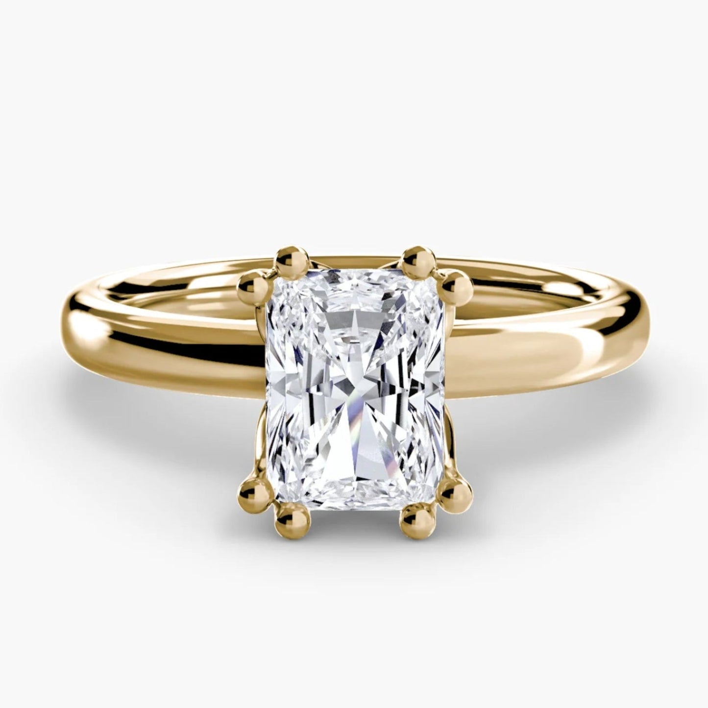 Gold ring with a diamond on a white background