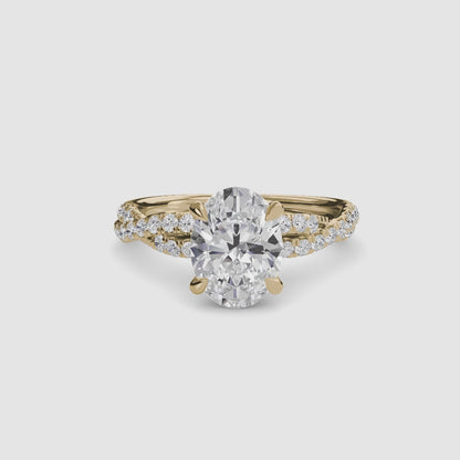 The Twisted Pavé Solitaire Oval in Yellow Gold